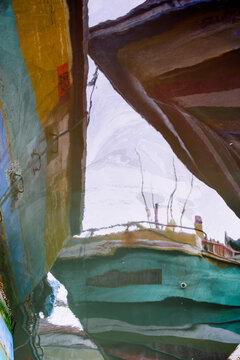 Reflection of colorful boats on water in Sri Lanka