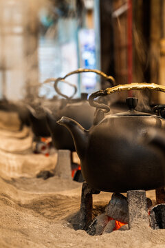 Traditional kettles steaming on open fire in Taiwan