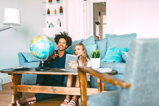 Couple exploring map at home