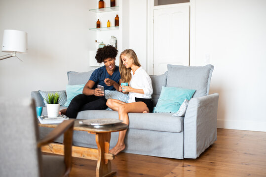 Happy multiethnic couple enjoying time at home