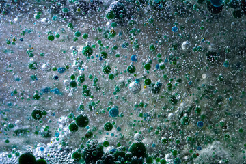 Abstract composition of colorful bubbles in liquid
