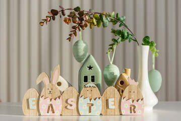 Wooden Easter Letter Eggs with Bunny and Chick Figures. Festive Spring Decor