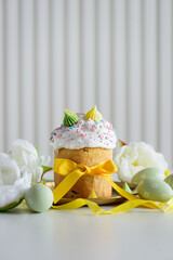 Easter Cake Decorated Yellow Ribbon with Flowers and Pastel Eggs on White Background