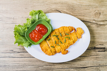 displays a dish of chicken katsu a Japanese-style fried chicken cutlet