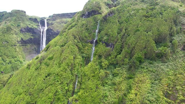 AZORES - 11.3.2025 - Amazing aerial panorama revealing the Cascada Da Ribeira Grande waterfalls on Azores' Flores.
