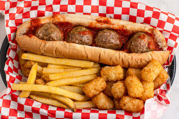 meat ball sub  with fries and tater tots