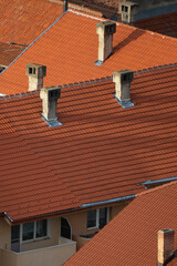 Red Tiled Rooftops with Chimneys in Residential Area