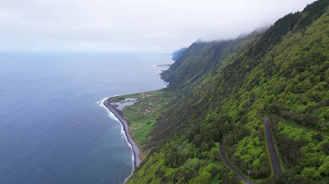 AZORES - 11.3.2025 - Great aerial footage of misty cliffs and Faja dos Cubres on the Azores' Sao Jorge Island.