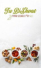 Mix of dry fruits and nuts, branch with young green leaves. Concept of the Jewish holiday Tu Bishvat