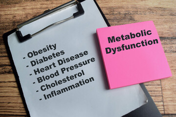 Concept of metabolic dysfunction write on sticky notes with keywords isolated on Wooden Table.