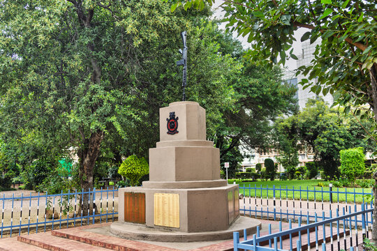 Gaborone Center War Monument with rifle sculpture in Botswana, featuring a rifle mounted on a plinth