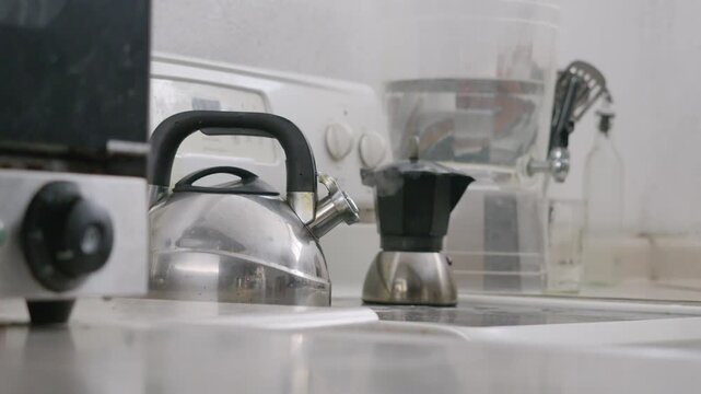 Close-up, cinematic shot of the moment when the water boils in the kettle.