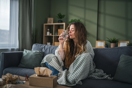 Young woman drinking water for hydration and wellness