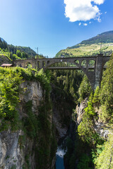 Historic Viaduct Spans Deep Gorge in Swiss Alps