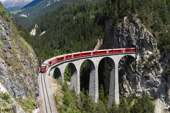 Historic train crossing Landwasser Viaduct in Switzerland