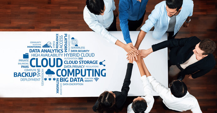 A diverse team collaborates on cloud computing strategies, focusing on data analytics and storage solutions in a modern work environment, emphasizing teamwork and technology. Amity - Powered by Adobe