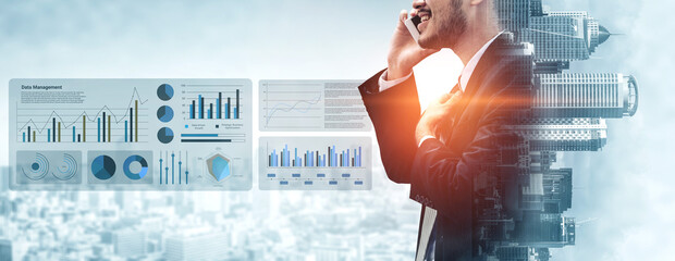 A business man engages in a phone conversation, surrounded by various data analysis charts and graphs, symbolizing growth and strategic decision-making in a modern office setting. Gantry