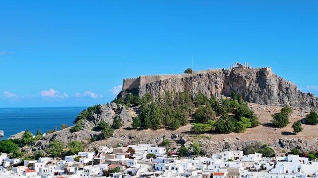 Lindos town and acropolis overlooking the Aegean Sea on Rhodes, Greece