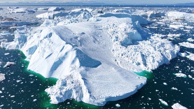 GREENLAND - 11.4.2025 - Amazing aerial footage circling counterclockwise around an ice field on Greenland's Disko Bay.