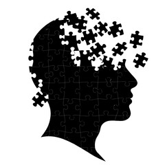 Human head silhouette with puzzle pieces forming the brain and face.