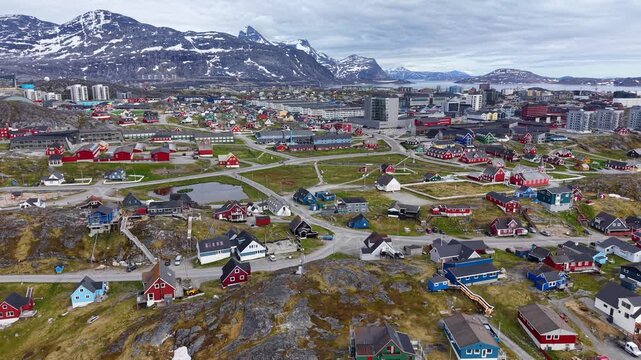 GREENLAND - 11.4.2025 - Amazing aerial panorama of Greenland's capital Nuuk, with snowy mountains in the background.