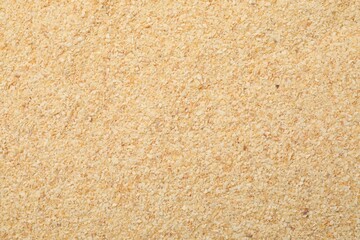 Granulated dried garlic as background, top view