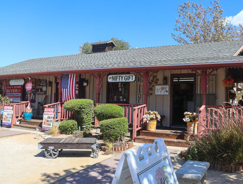 Temecula CA, USA on October 8, 2022. View of shops in Old Town Temecula, California. The Nifty Gift and All Valley Coins and Jewelry store fronts.