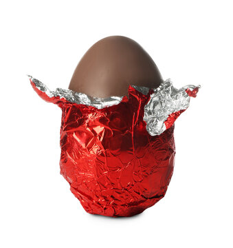 Chocolate egg wrapped in red foil isolated on white. Happy Easter