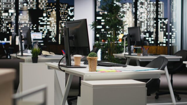 Empty dark office features high tech gadgets and dual monitors, analytics tools ready for business strategy and report writing to support professional growth and organizational success. - Powered by Adobe