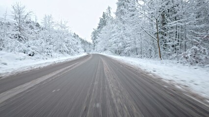 Car Driving Through Scenic Winter Forest Down Narrow Road Covered Fresh Snow