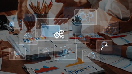 A collaborative scene showing teamwork in a modern office. Digital icons for analytics and visualization enhance the discussion on marketing strategy, planning, and research. Raster
