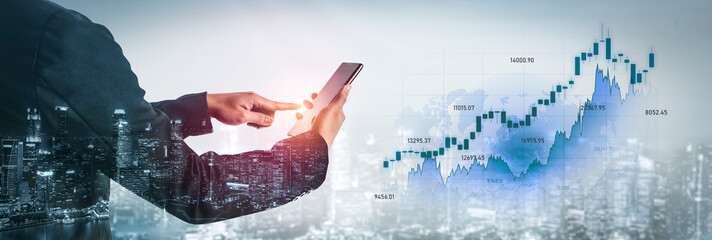 A businessman interacts with a smartphone to examine stock market trends, featuring a digital financial graph against a vibrant urban skyline at dusk. Scalp