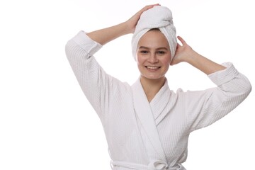 Beautiful woman with hair wrapped in towel on white background