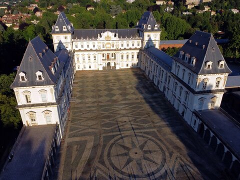 Aerial view of the Valentino Castle, a historic building in the northwestern Italian city of Turin. It is located in Parco del Valentino. Turin, Italy - 06.20.2020