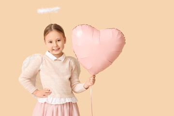 Naklejka premium Cute little girl dressed as cupid with air balloon in shape of heart on beige background. Valentine's Day celebration