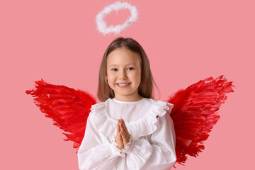 Fototapeta premium Cute little girl dressed as cupid on pink background. Valentine's Day celebration