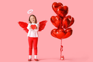 Fototapeta premium Cute little girl dressed as cupid with gift box and air balloons in shape of heart on pink background. Valentine's Day celebration