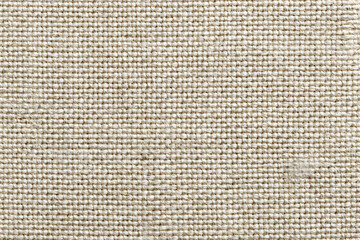 close-up of beige woven fabric with uniform texture and small yarn loops