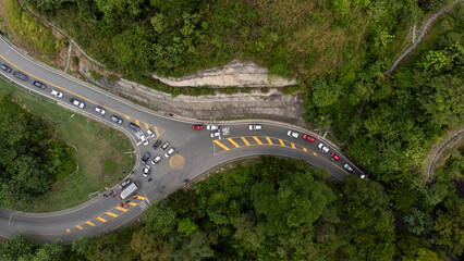 Sinifana, Antioquia - Colombia. October 8, 2025. Winding road in the Sinifan&aacute; road corridor, surrounded by green mountains