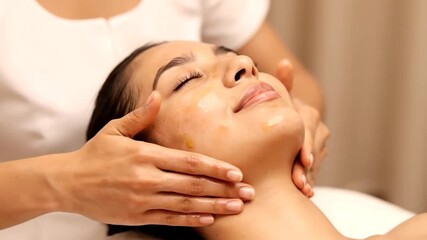 Serene spa treatment with gentle facial massage and oil application