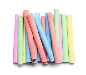 Many colorful chalks on white background
