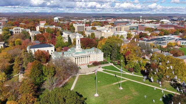 PENNSYLVANIA - 11.10.2025 - Amazing aerial footage circling Penn State University's Old Main building.