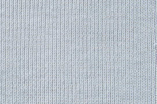Soft light gray jersey knit fabric pattern close up as background