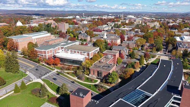PENNSYLVANIA - 11.10.2025 - Wonderful aerial view of traffic driving past Penn State University in autumn.