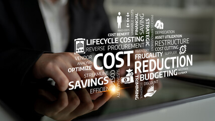 A business professional engages with cost reduction strategies using a tablet, showcasing budgeting...