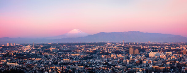 Yokohama city skyline panoramic landscape with Fuji Mountain at sunrise in Kanagawa, Japan, a hazy...