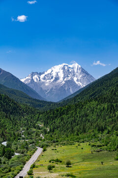 landscape of road with Yala snow mountain and forest in Sichuan