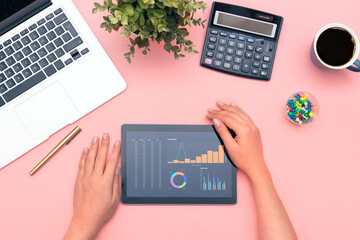 Business charts on tablet top view