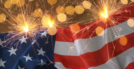 Flag of United States of America and sparklers, banner design. National holiday greeting card