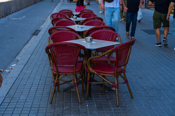 table and chairs at a street cafe in the old town